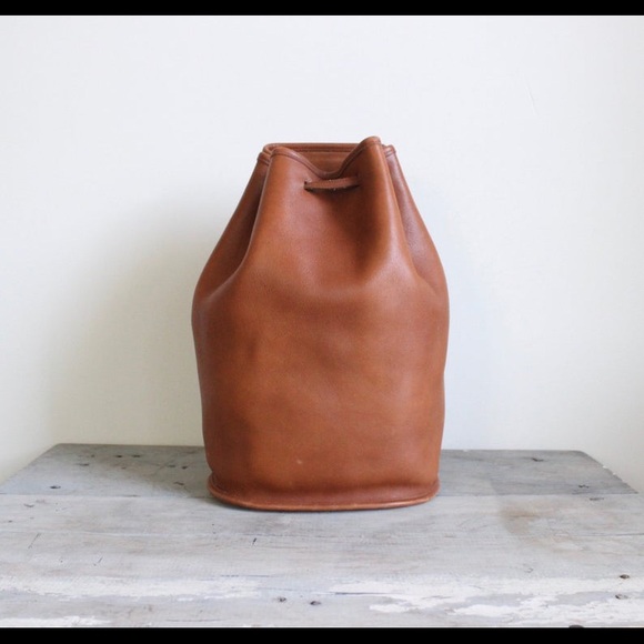 Coach Handbags - Vintage Coach Sling Leather Drawstring Backpack